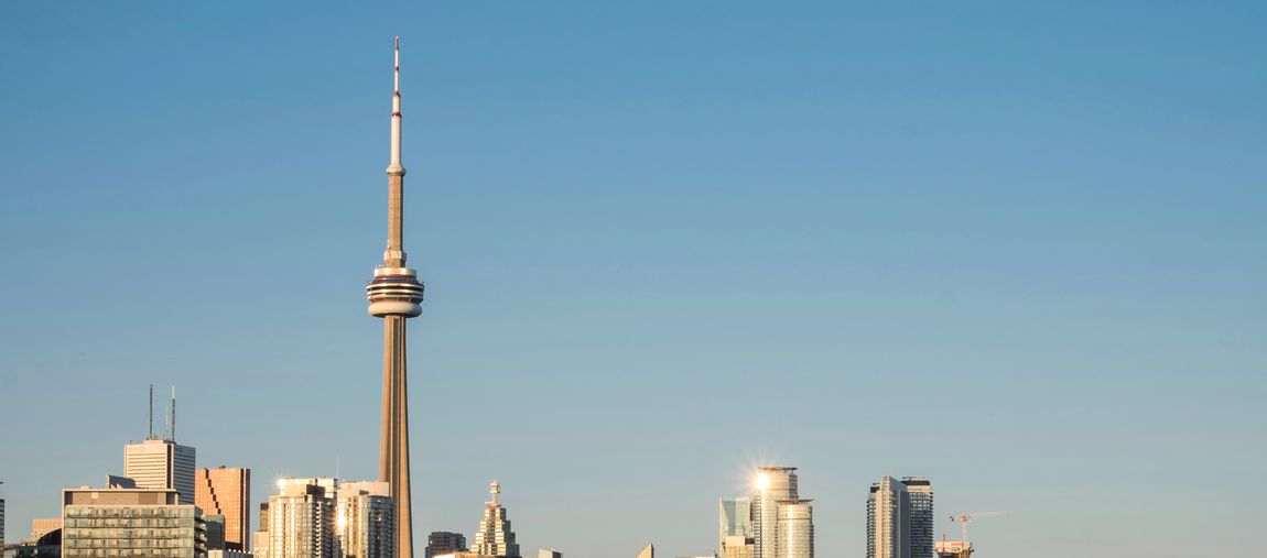 Student in front of the CN Tower, Canada