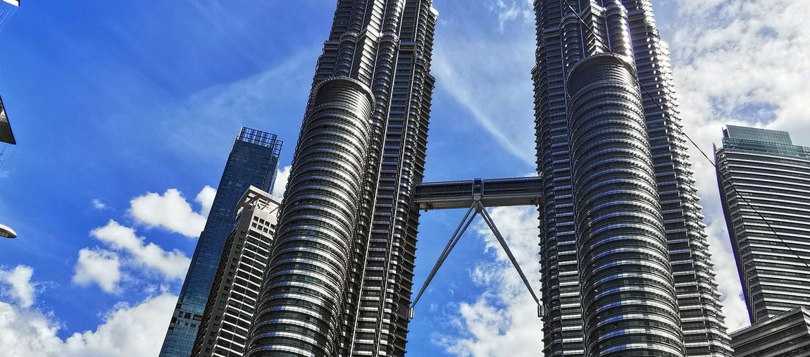 Student in front of the Petronas Towers, Malaysia